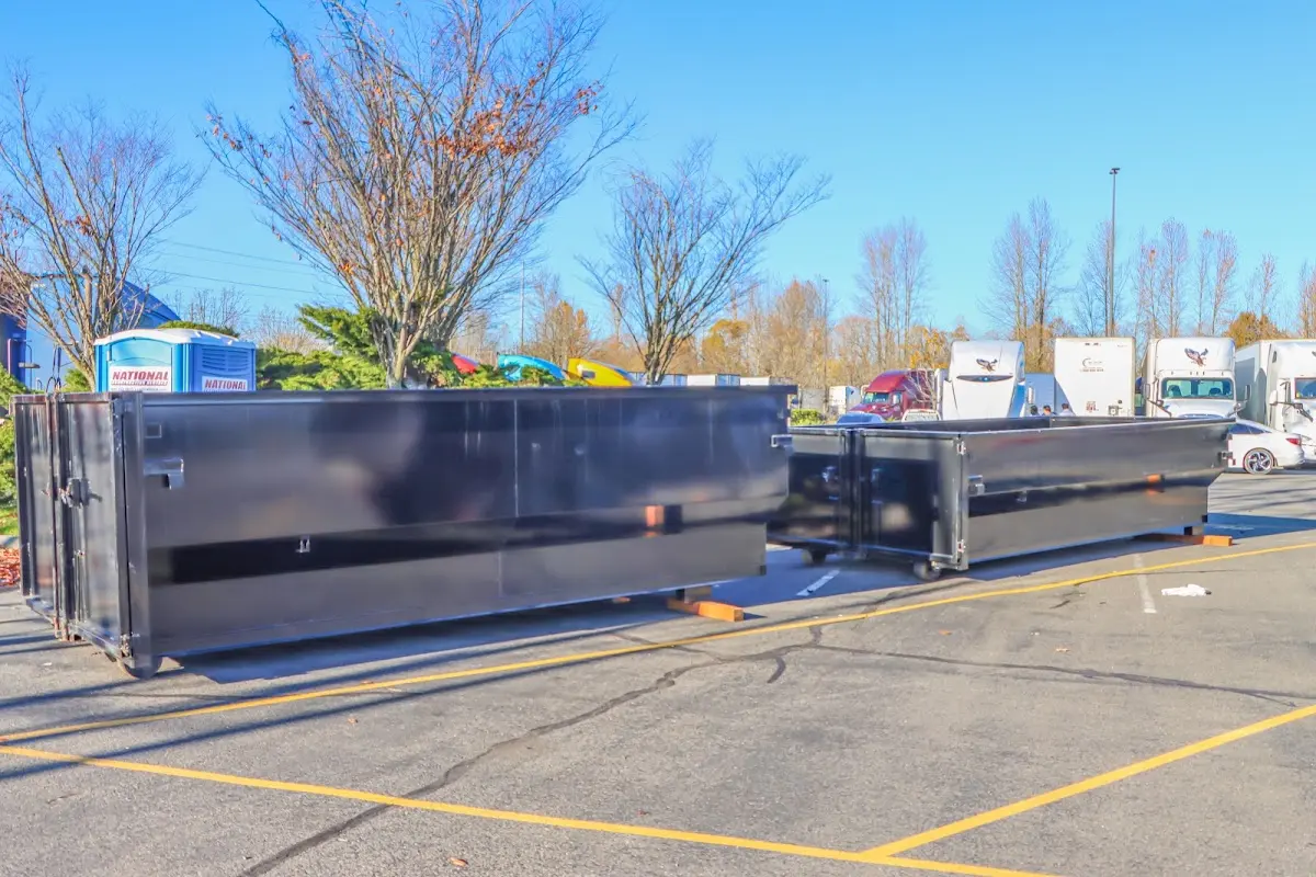 Professional dumpster rental service with roll-off container on residential driveway in Weisenberg